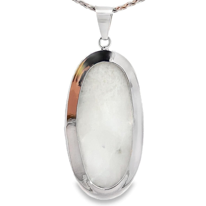 photo of a long oval silver white moonstone pendant on a white background rear view