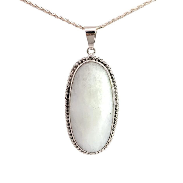 photo of a long oval silver white moonstone pendant and chain  on a white background