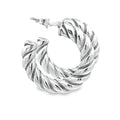 photo of silver twisted hoop earrings on a white background