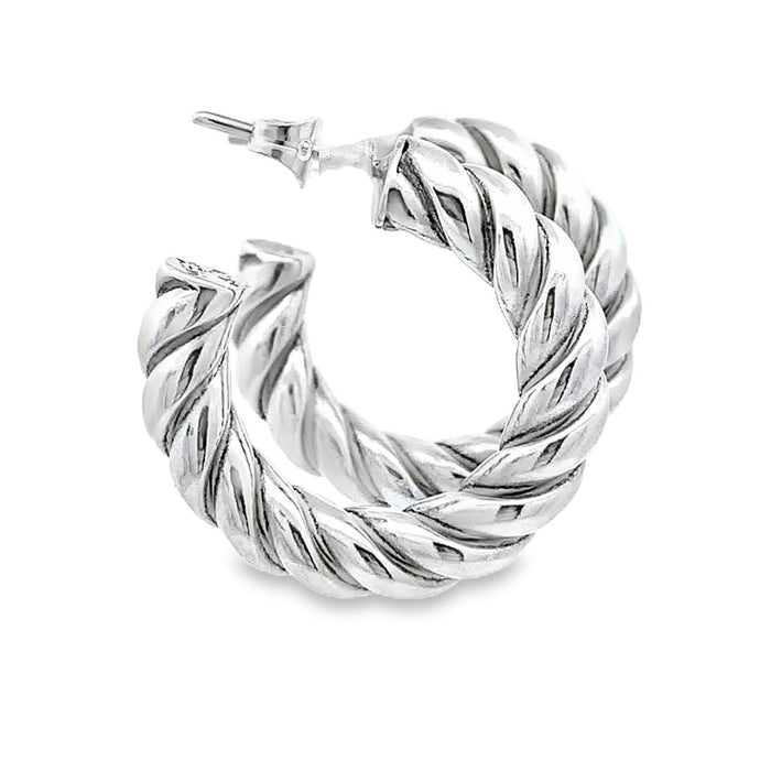 photo of silver twisted hoop earrings on a white background
