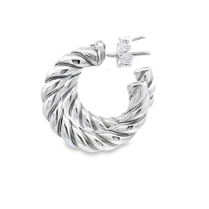 photo of silver twisted hoop earrings on a white background side view