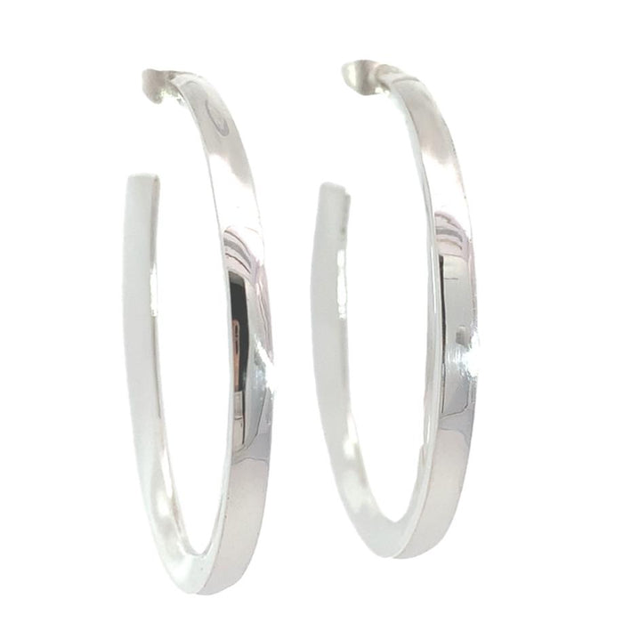 photo of a wide tapering silver hoop earring on a white background front view