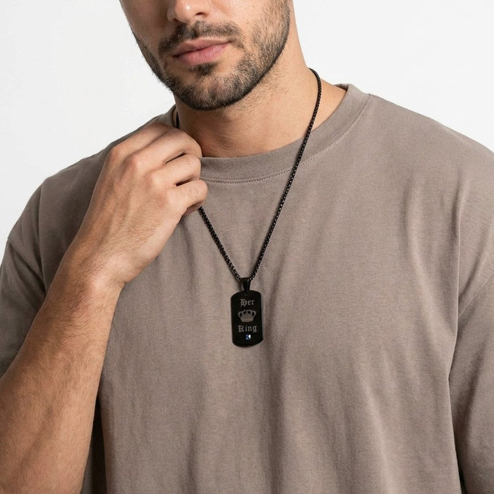 A bold symbol of confidence and connection, this necklace brings a strong, masculine edge with a meaningful touch. With its sleek tag design and engraved crown detail, it represents loyalty, love, and the quiet power of being someone’s king.