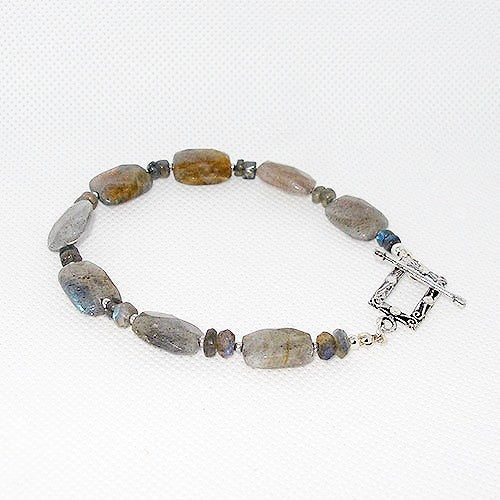 Beaded bracelet with natural stone beads on a white background