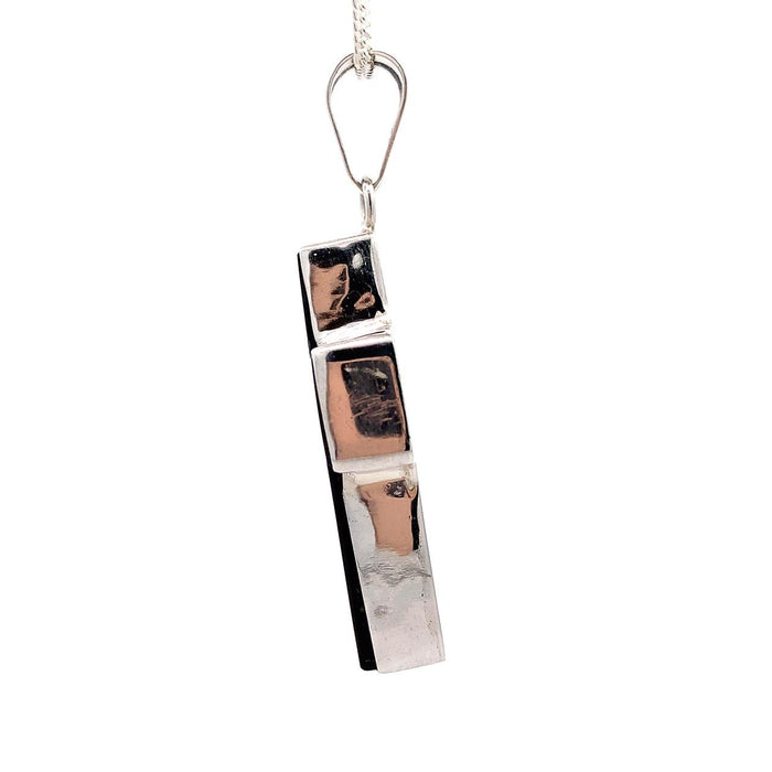 Taxco sterling silver cross pendant with solid black obsidian inlay and plain bail side view