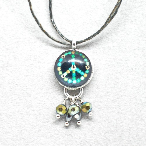 Necklace with a peace symbol pendant on a white background