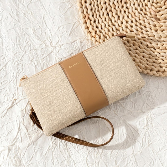 Elegant, lightweight, and effortlessly easy to style, the Luxe Classic Bag is made for everyday moments that call for something simple yet polished. Designed with a clean solid-color look, subtle woven texture, and a practical wrist strap, this compact bag is perfect for carrying your small essentials while keeping your outfit neat and refined.