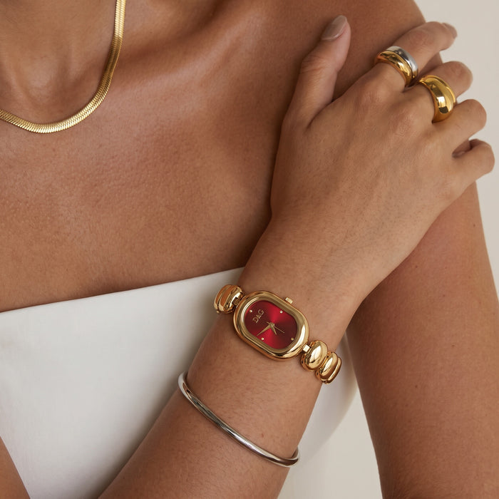 Elegant, polished, and beautifully feminine, the Luxe Oval Watch is made for someone who loves graceful timepieces with a refined jewelry-inspired touch. Designed with a smooth oval dial, rounded bracelet links, and a glossy metallic finish, this watch brings a sophisticated glow that feels perfect for everyday styling, office wear, special occasions, or thoughtful gifting.