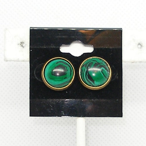 Green round earrings brass settings on a black card against a white background