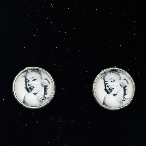 Pair of earrings with a portrait of a famous actress on a black background