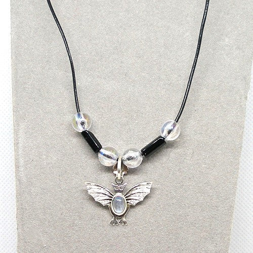 Necklace with a silver bat pendant on a gray background