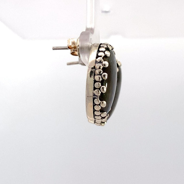 Photo of oval labradorite silver earrings on a white background Side view