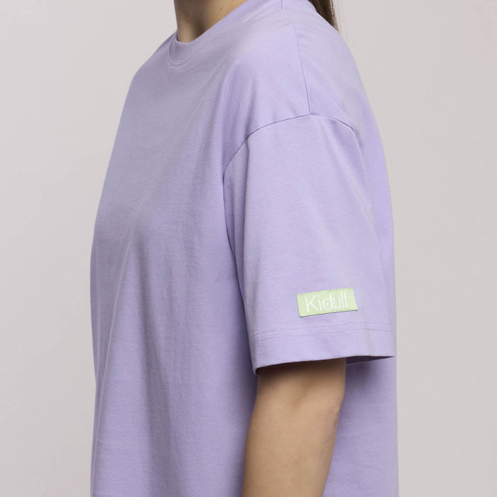 T-shirt oversize con frase: Testa dura cuore folle anima ribelle