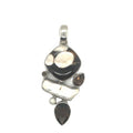 photo of a  six-gem brown and white silver pendant on a white background