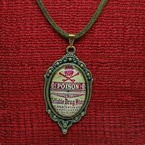 Medallion with 'POISON' label on a red fabric background