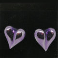 Heart-shaped earrings on a black background