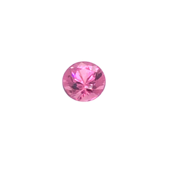photo of a loose round hot pink Garnet on a white background