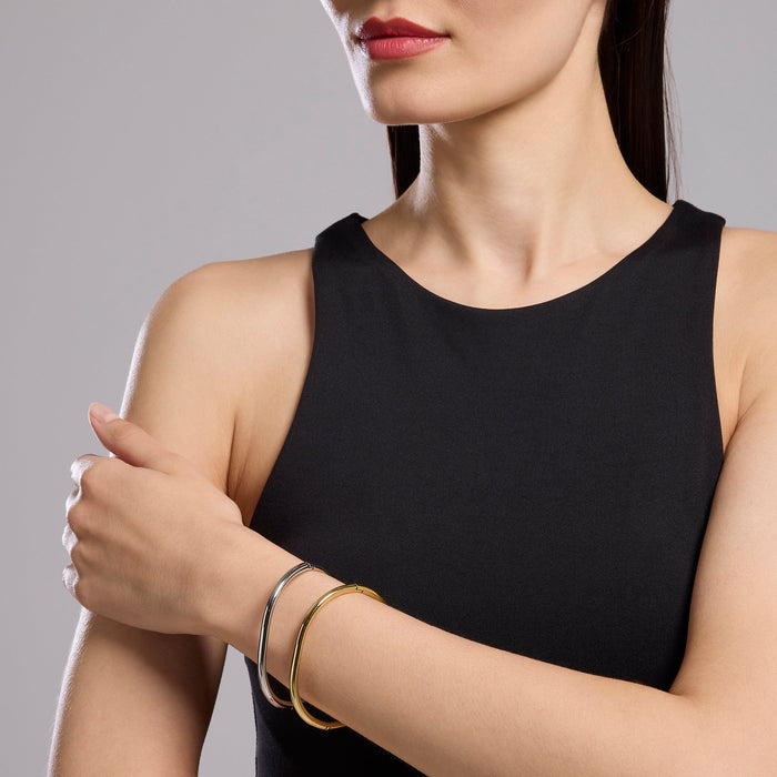 Bracciale rigido in acciaio dorato