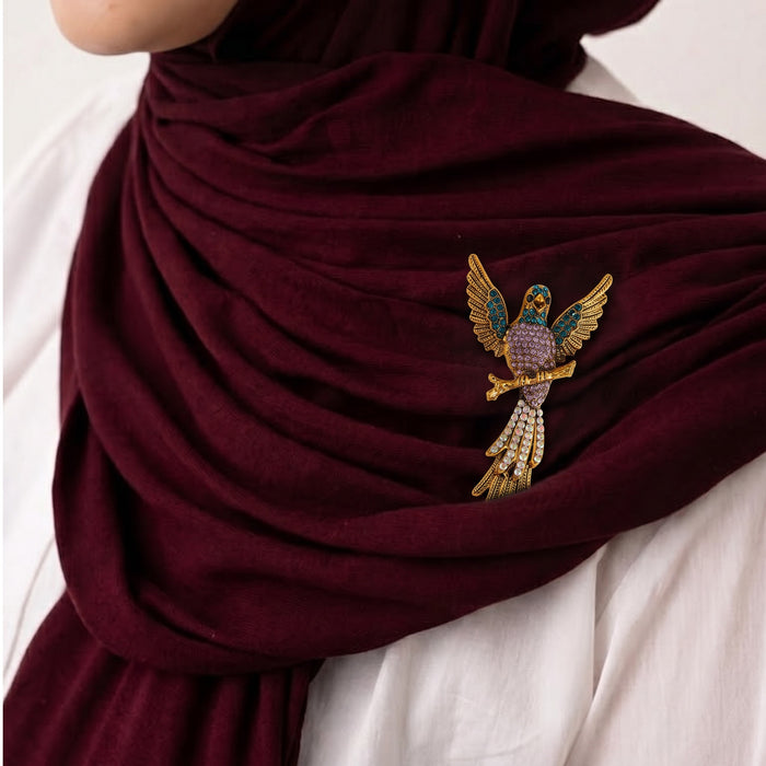 Bold, artistic, and full of character, the Royal Parrot Brooch is a striking statement piece designed to bring charm and personality to any look. Featuring a beautifully detailed parrot silhouette with rich jewel-toned accents, this brooch adds a playful yet elegant touch to outfits, scarves, bags, or gifting collections. Its vibrant design makes it perfect for anyone who loves standout accessories with a regal feel.