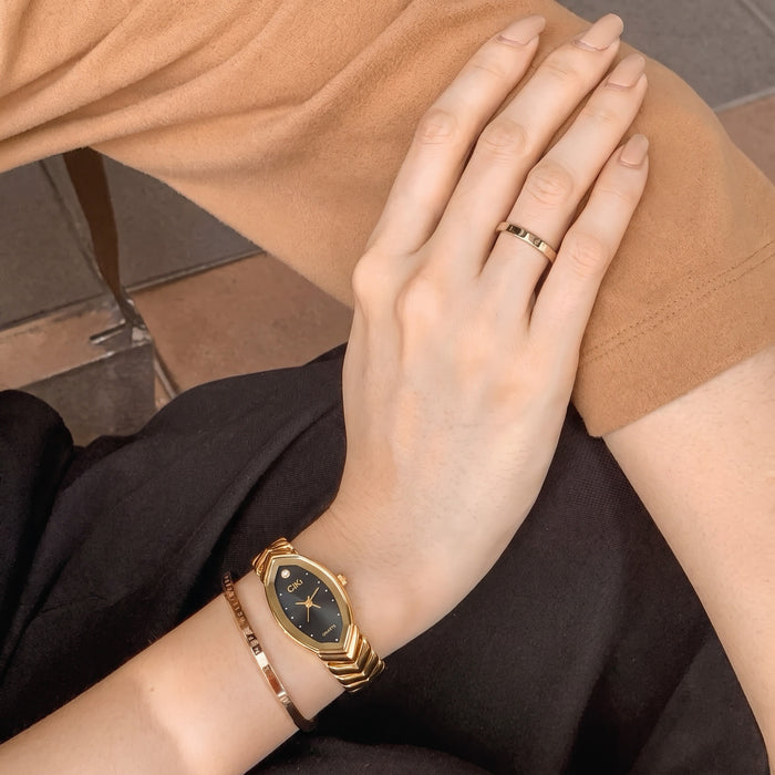 Elegant, polished, and beautifully feminine, the Royal Petal Watch is made for someone who loves graceful timepieces with a regal jewelry-inspired touch. Designed with a slender petal-shaped dial, sparkling crystal accent, and sculpted golden bracelet links, this watch brings a luxurious glow that feels perfect for everyday styling, office wear, special occasions, or thoughtful gifting.