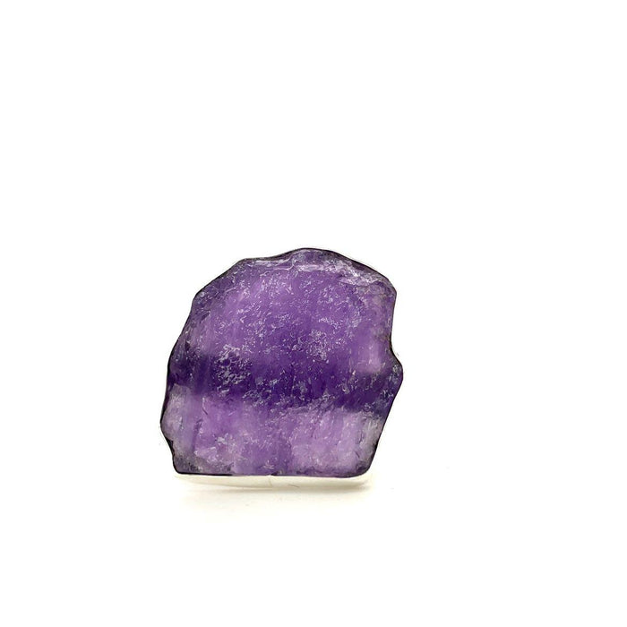 photo of an oversize silver amethyst raw slab ring on a white background front view