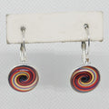 Colorful spiral earrings on a white background