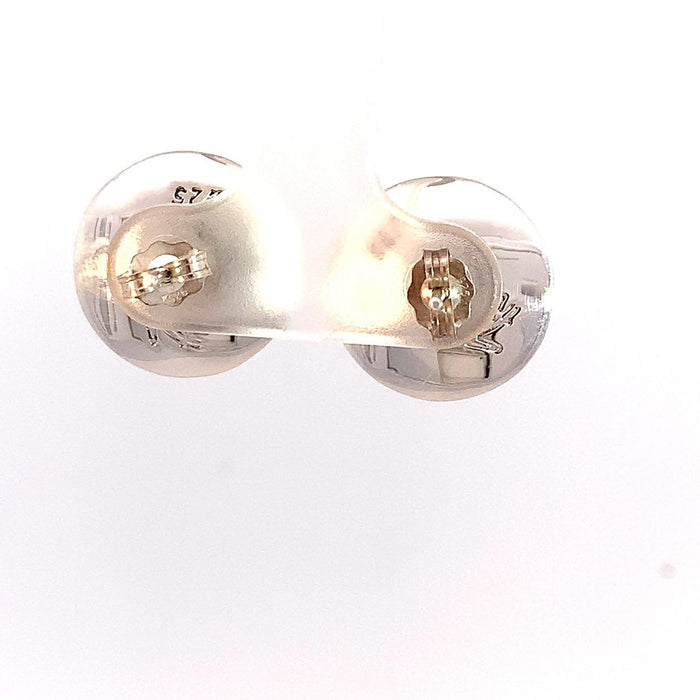 photo of silver earrings set with a blue chalcedony cabachon on a white background rear view