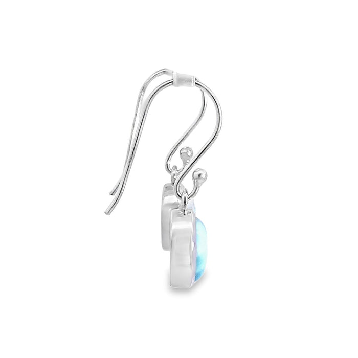 Photo of a silver earring set with oval cabochon blue Larimar on a white background Side view