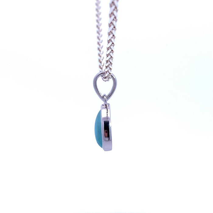photo of a river pear-shaped blue Larimar pendant necklace on a white background side view