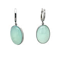 Photo of silver oval blue chalcedony drop earrings on a white background