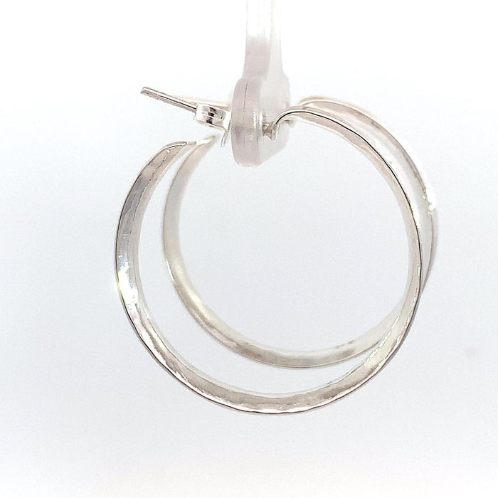 Taxco sterling silver concave hammered hoop earrings with textured artisan finish and post clutch backing side view