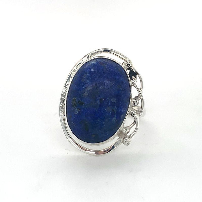 A Sterling Silver Lapis Ring featuring a large oval cabochon Lapis Lazuli set in a fine silver bezel-setting, with a scalloped edge design.