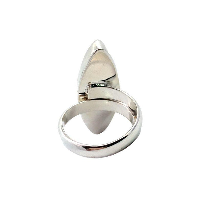 photo of a silver ring set with a long marquise moonstone on a white background rear view