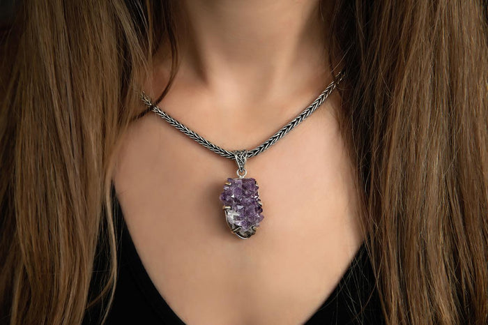 photo of a brunette model wearing an amethyst druzy sterling silver pendant