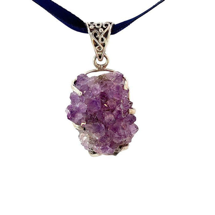 photo of a sterling silver amethyst druzy pendant on a ribbon on a white background front view