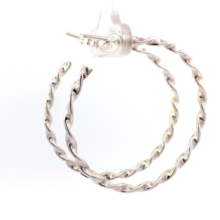 photo of  a twisted silver hoop earring