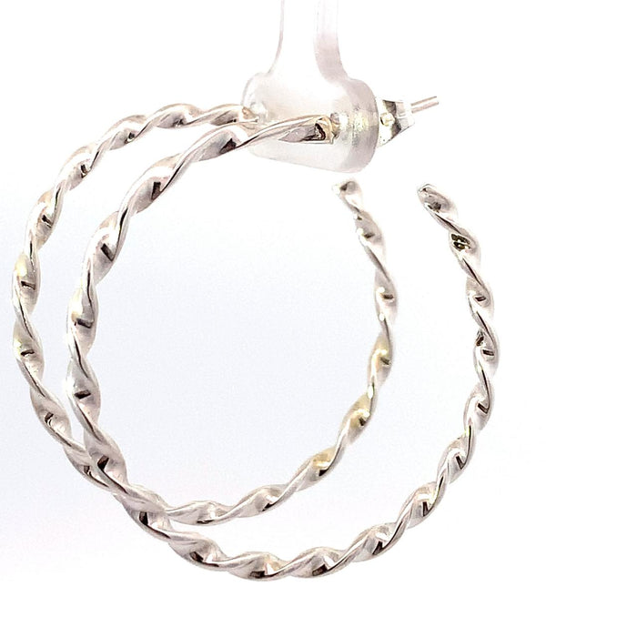 photo of  a twisted silver hoop earring