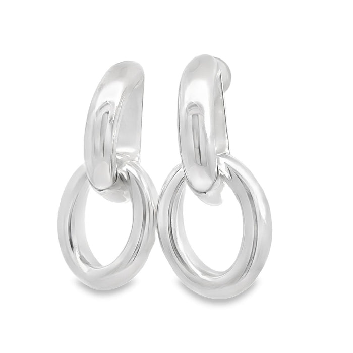 photo of a pair of large silver two-part doorknocker earrings on a white background