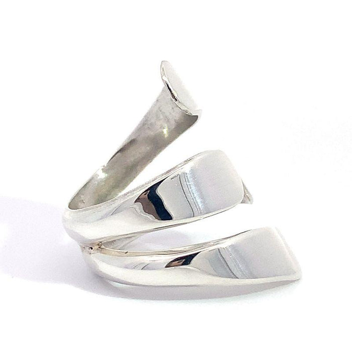 photo of a modern silver ring on a white background side view