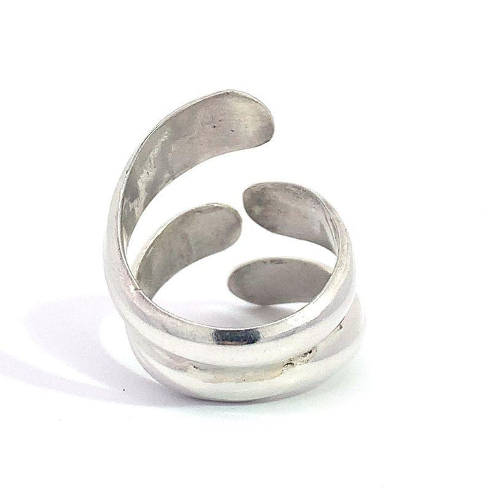 photo of a modern silver ring on a white background rear view
