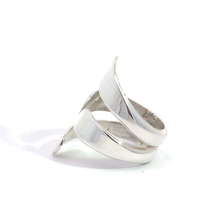photo of a modern silver ring on a white background side view