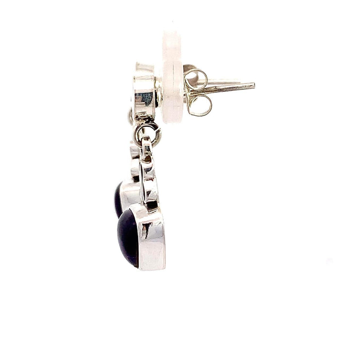 photo of a silver drop earring with a trillion cabochon amethyst bottom on a white background side view