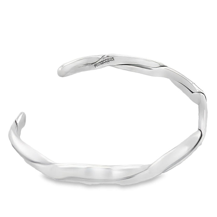 photo of a silver cuff on a white background