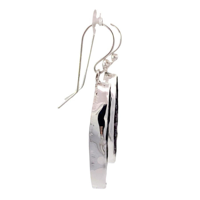 photo of long silver geode earrings on a white background,side view