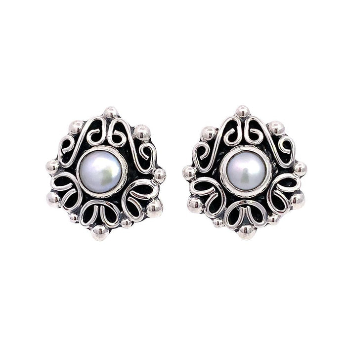 Taxco artisan sterling silver pearl stud earrings bezel set pearl with raised scrollwork frame handcrafted Mexican silver jewelry