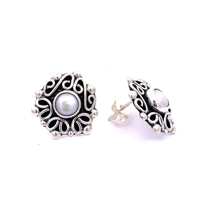 Taxco artisan sterling silver pearl stud earrings bezel set pearl with raised scrollwork frame handcrafted Mexican silver jewelry