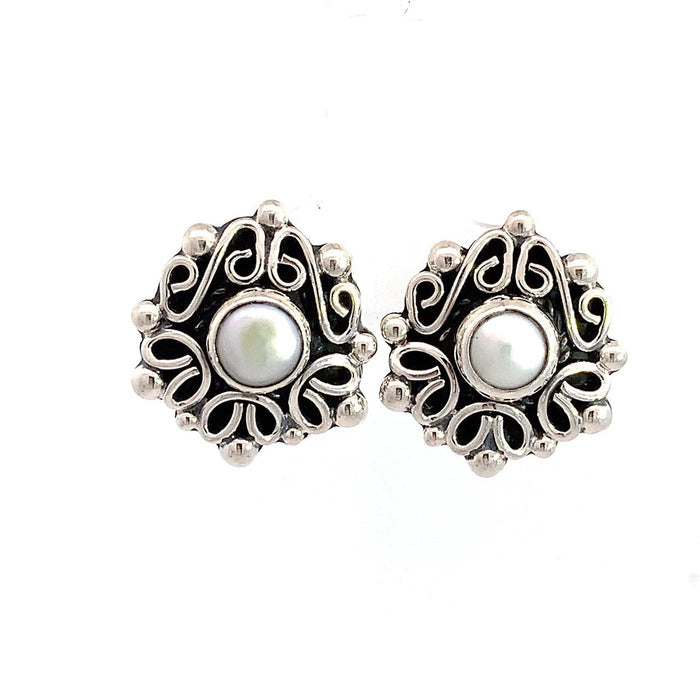Taxco artisan sterling silver pearl stud earrings bezel set pearl with raised scrollwork frame handcrafted Mexican silver jewelry