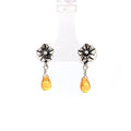 photo of a silver earring-handmade floral top and dangle natural yellow sapphire briolette on a white background