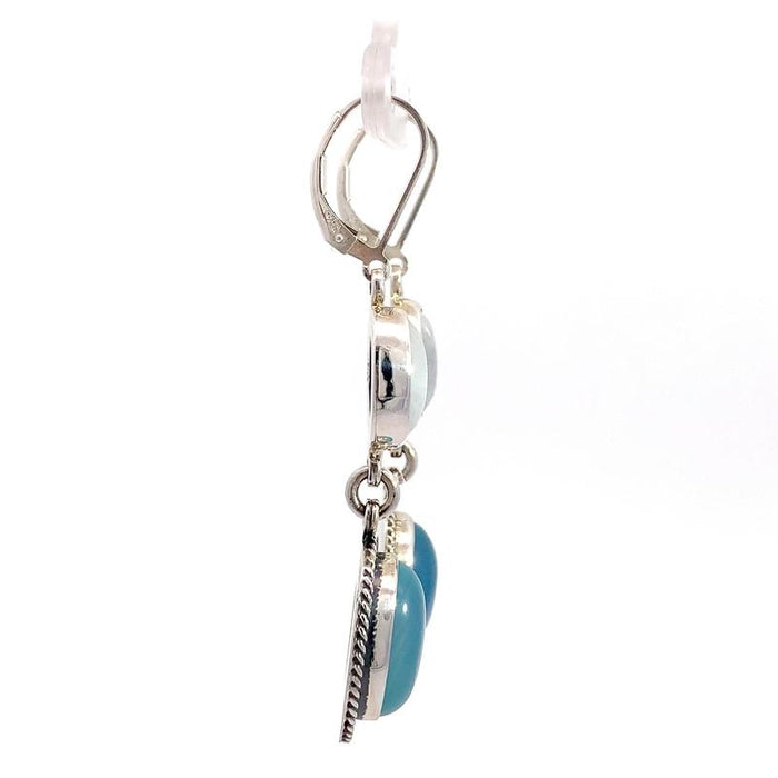 photo of  a 2-part dangle silver earring with oval moonstone and oval blue chalcedony on a white background side view