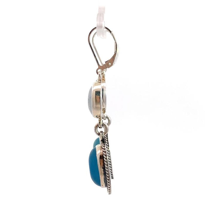 photo of  a 2-part dangle silver earring with oval moonstone and oval blue chalcedony on a white background side view